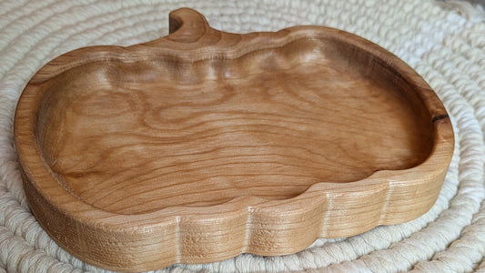 Wooden tray on a textured woven mat